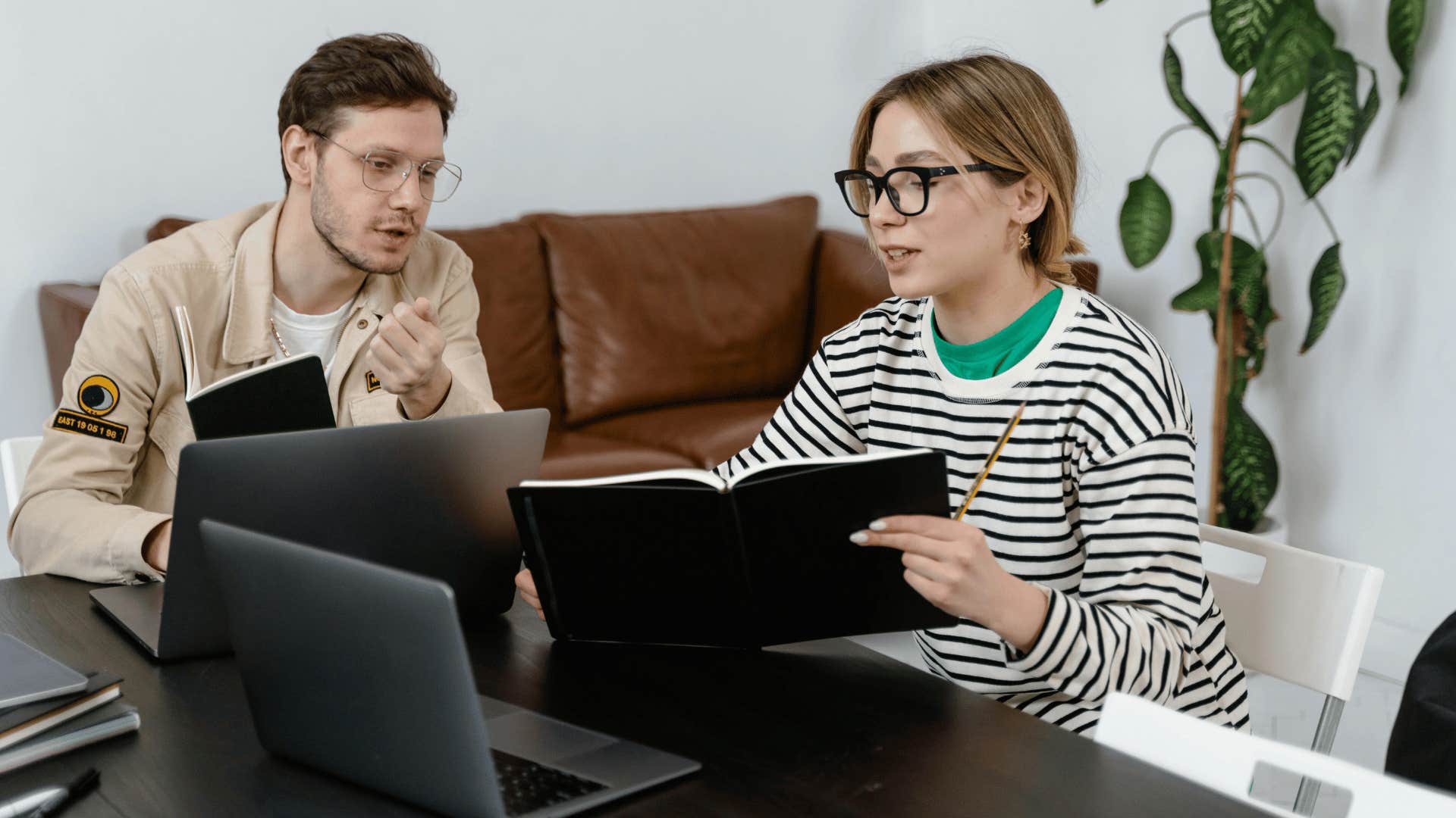 woman explaining something to man