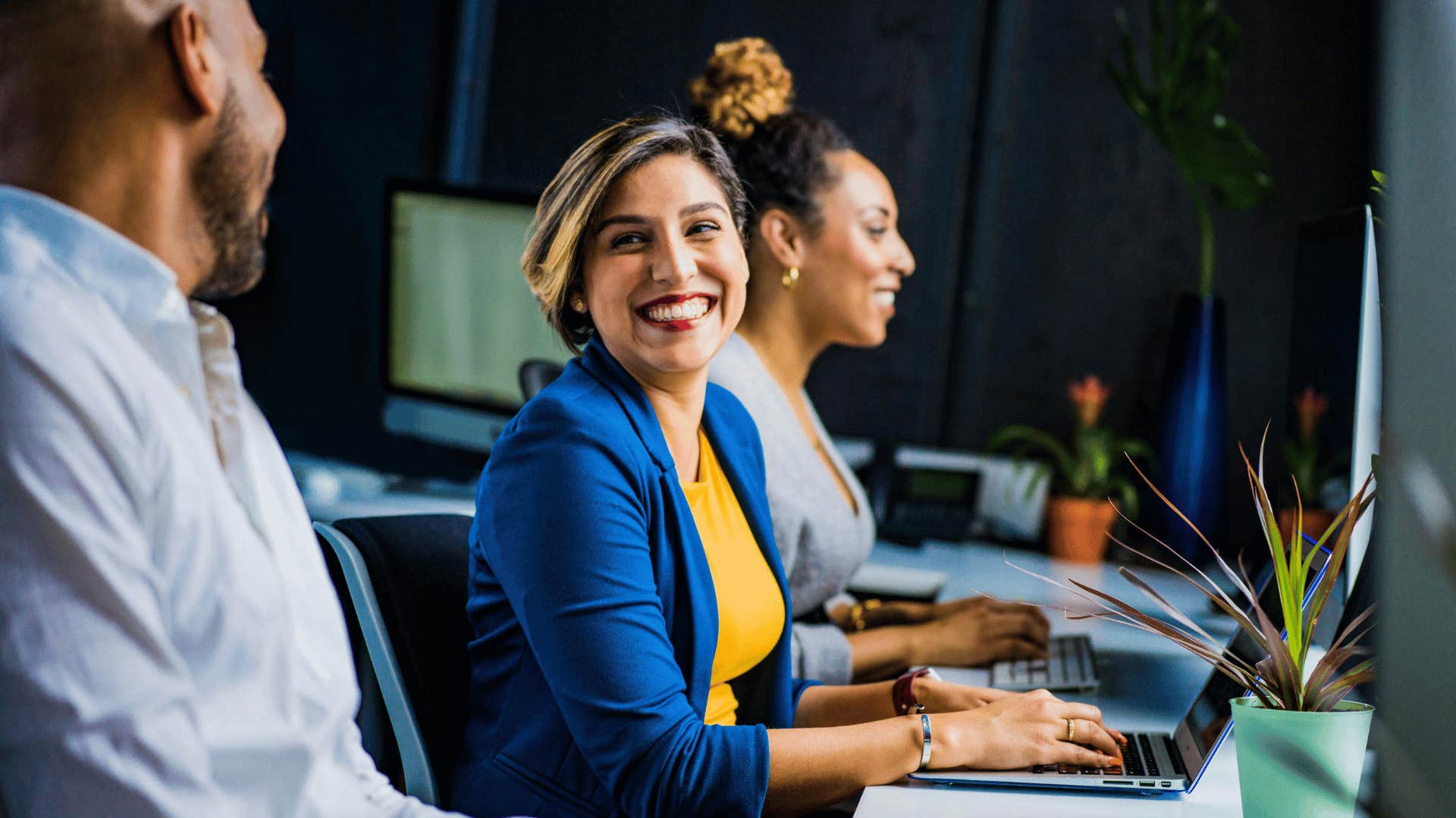 woman smiling at coworker