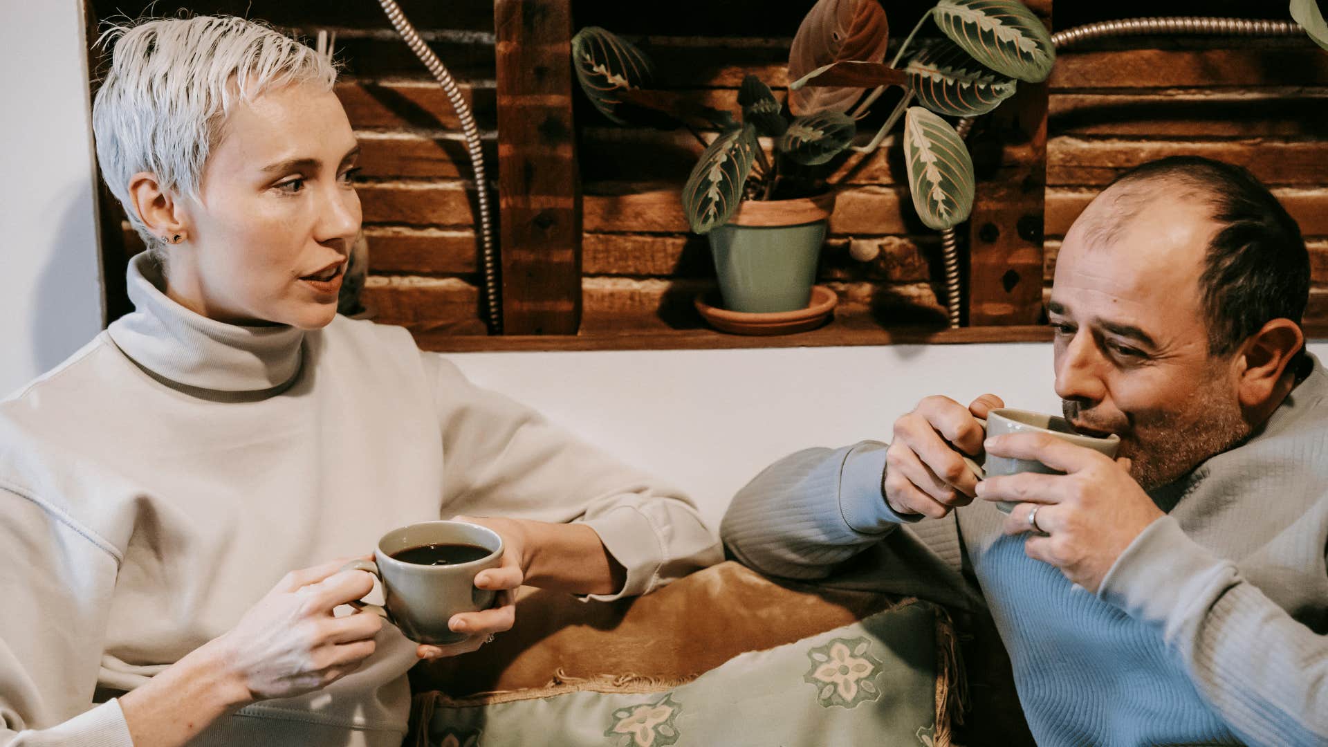 man and woman having calm discussion over coffee