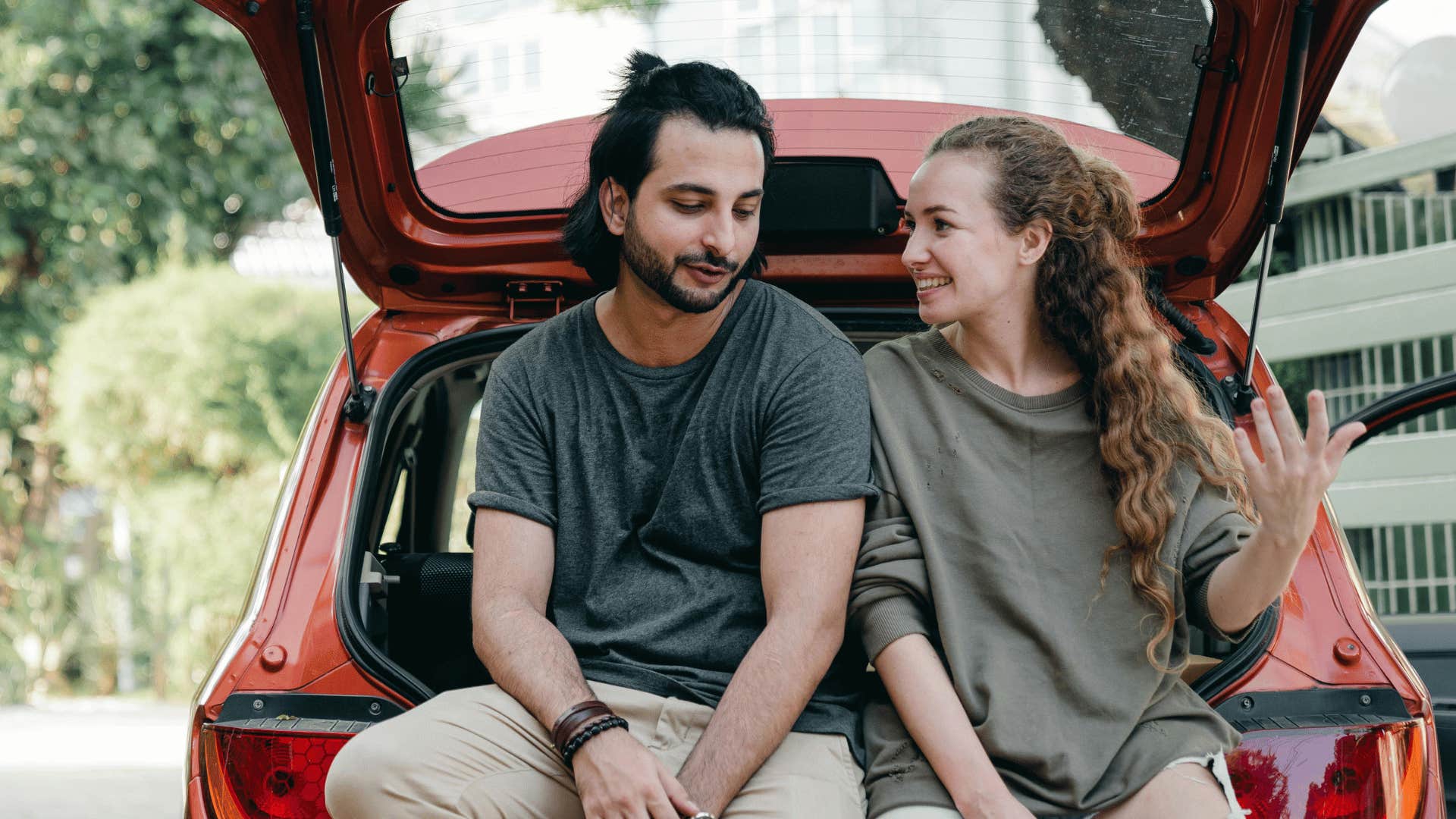 couple sitting talking in the car