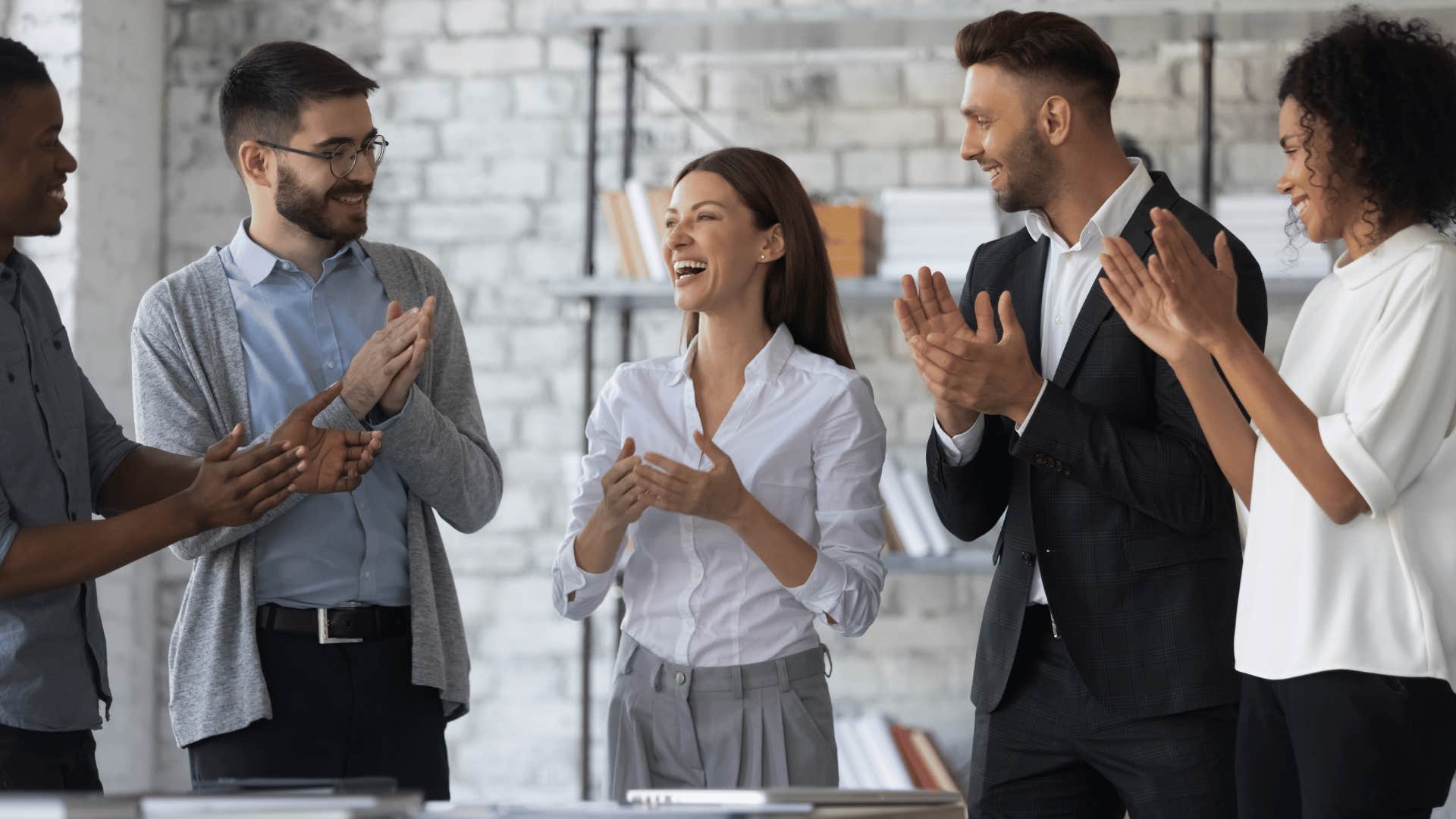 coworkers clapping