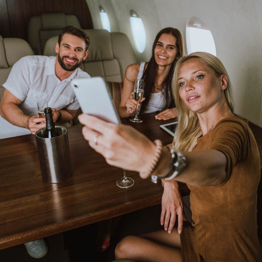 Friends hanging out together on a plane. 