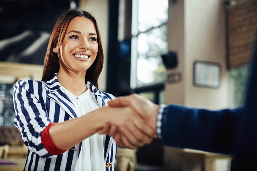 man and woman handshake in the cafe.