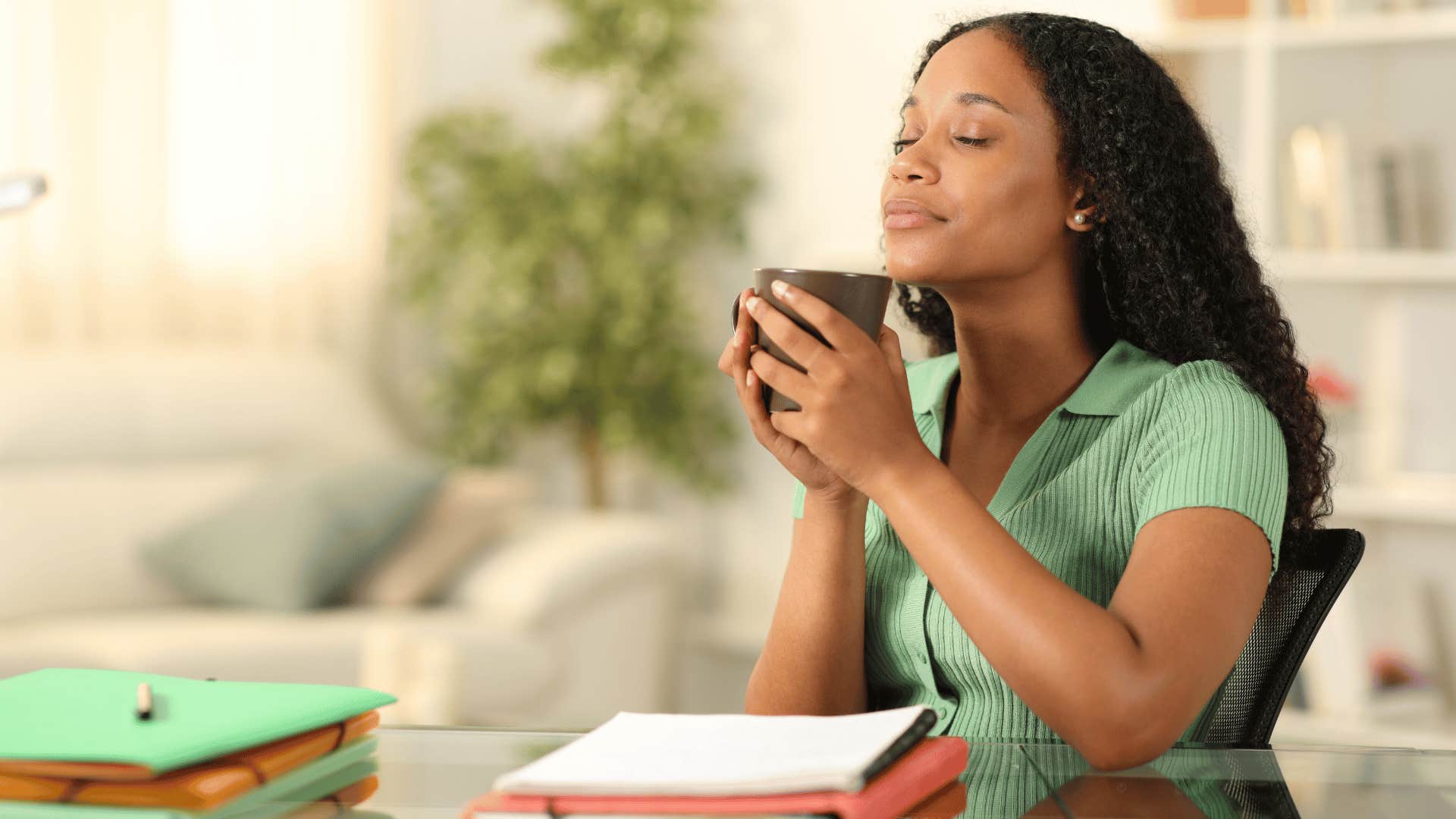 woman at peace drinking hot beverage