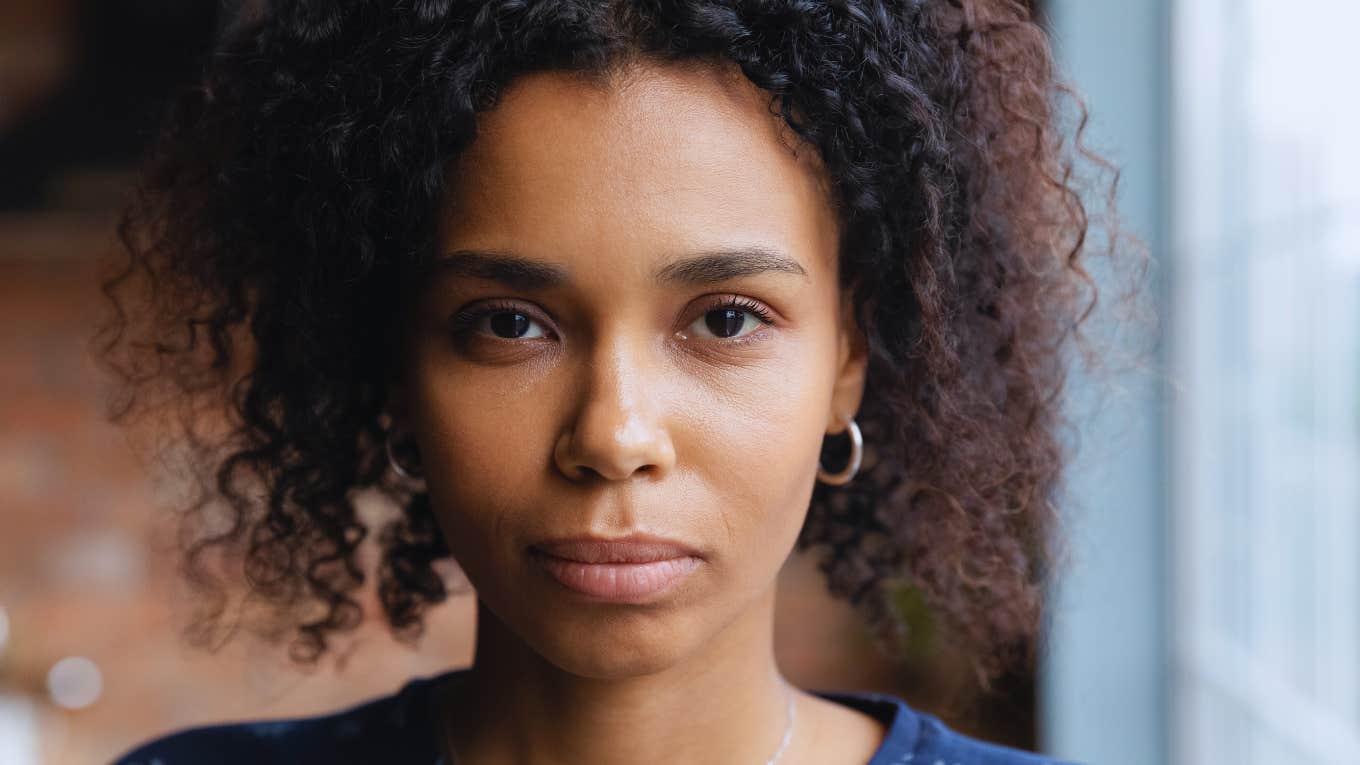 unhappy woman giving up her identity to make others happy