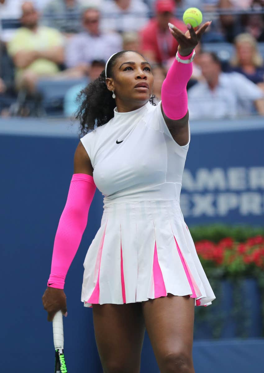 Serena Williams playing tennis on the court