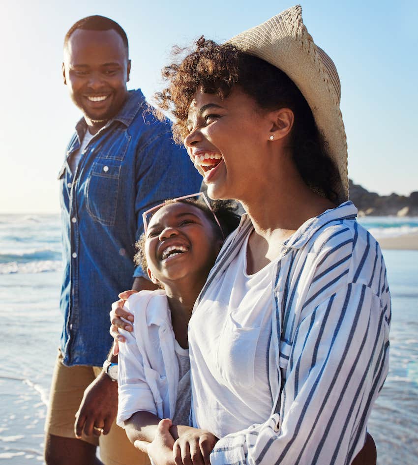 Happy family at beach, parents know will keep them married