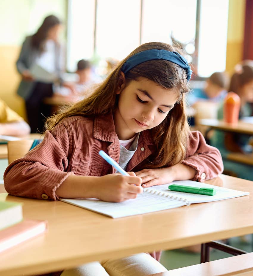 Student doing work in classroom has adjusted to going back to school