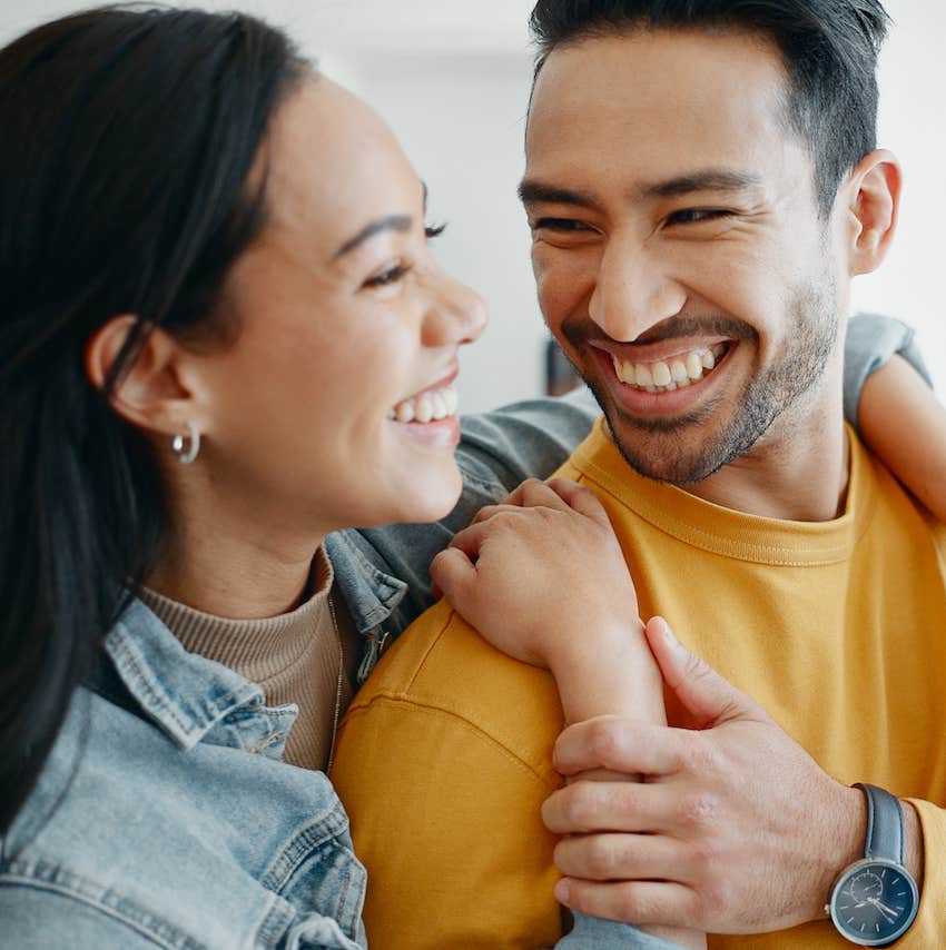 Hugging and smiling couple, she knows he is husband material