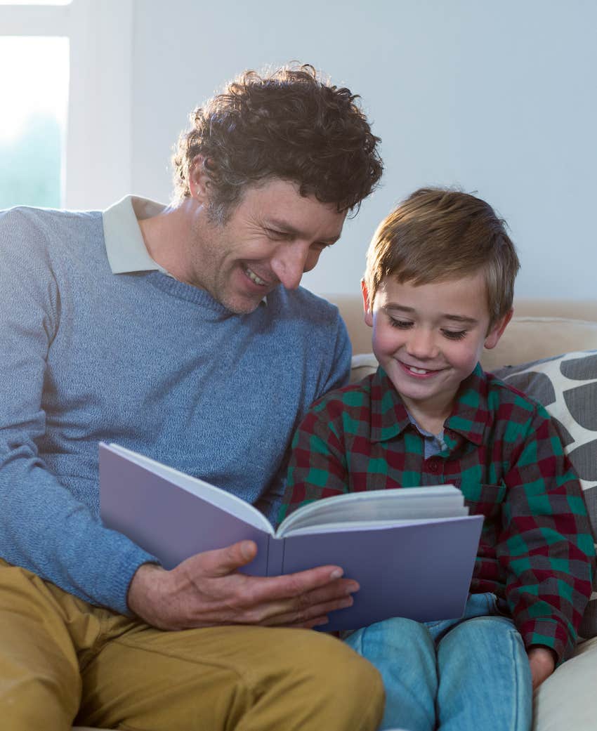 Parent reads to happy child, spending time together is never a mistake