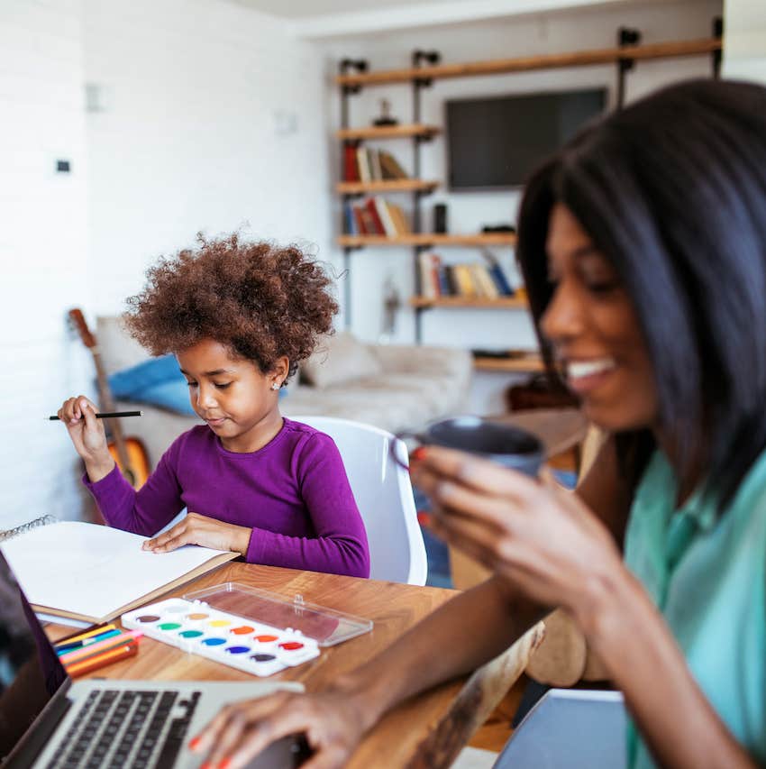 Child paints while parent is online, sharing space affects your kids