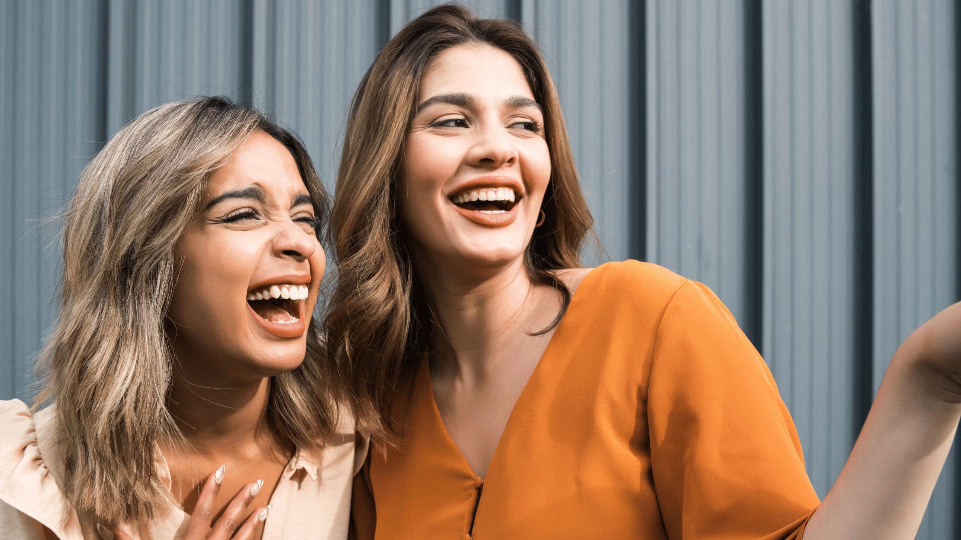 two women laughing 