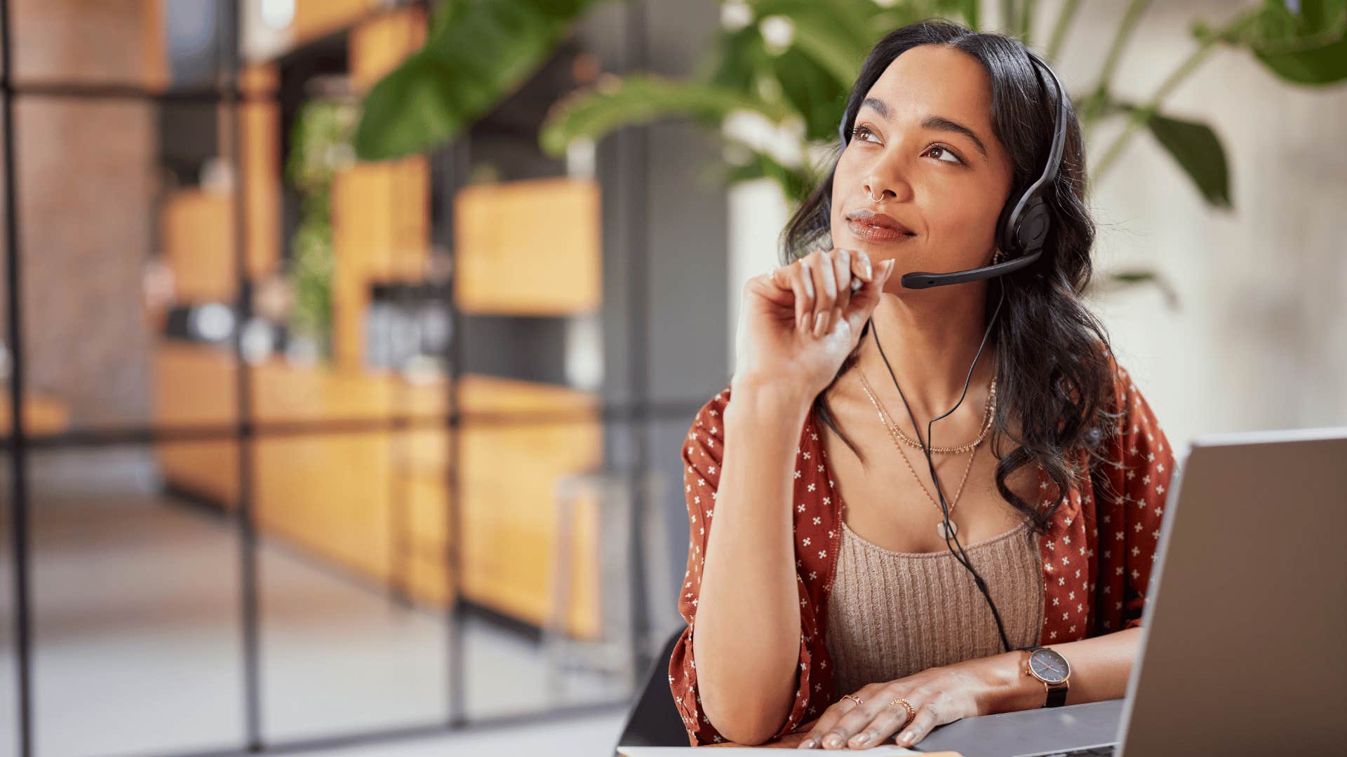 woman in deep thought while working 