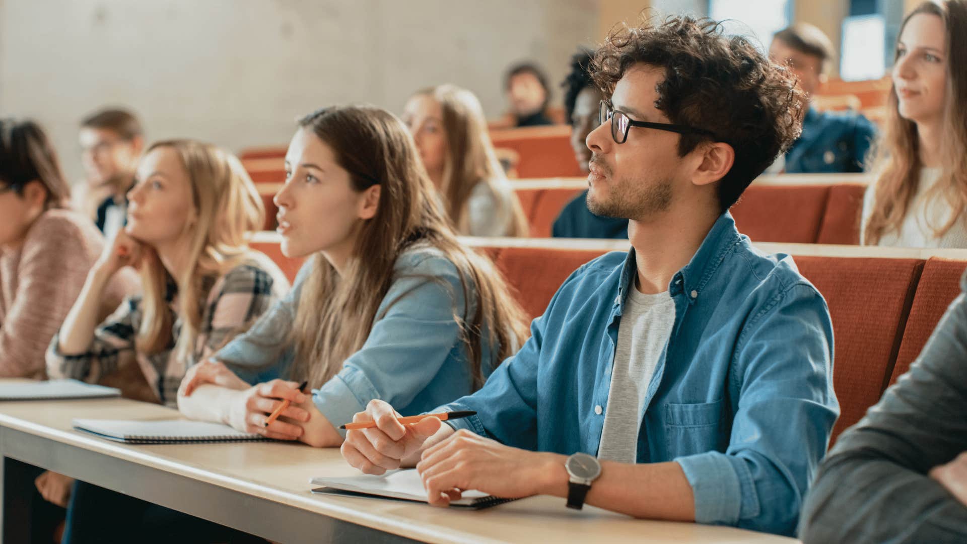 man listening and thinking deeply while in class