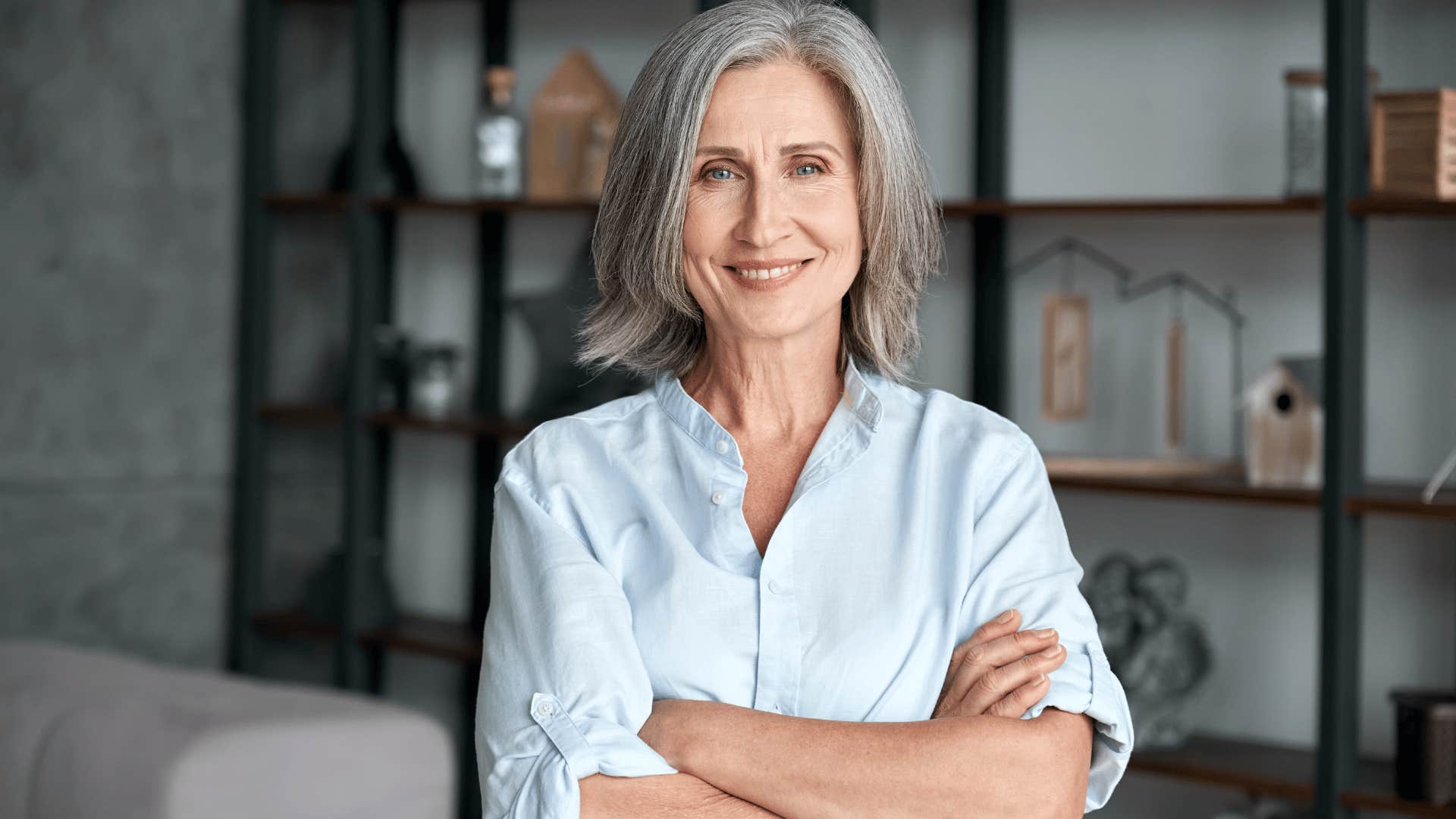 woman crossing arms while smiling