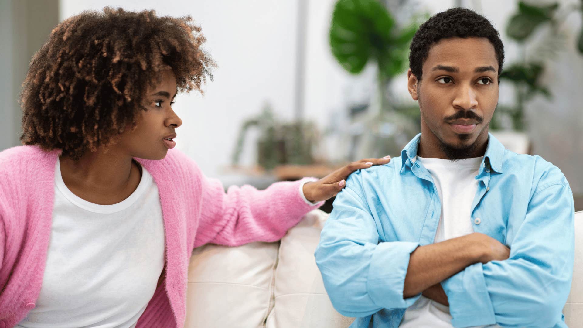 tense couple sitting on couch