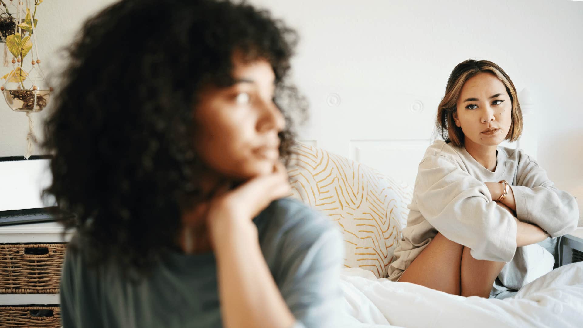 two sad women sitting together