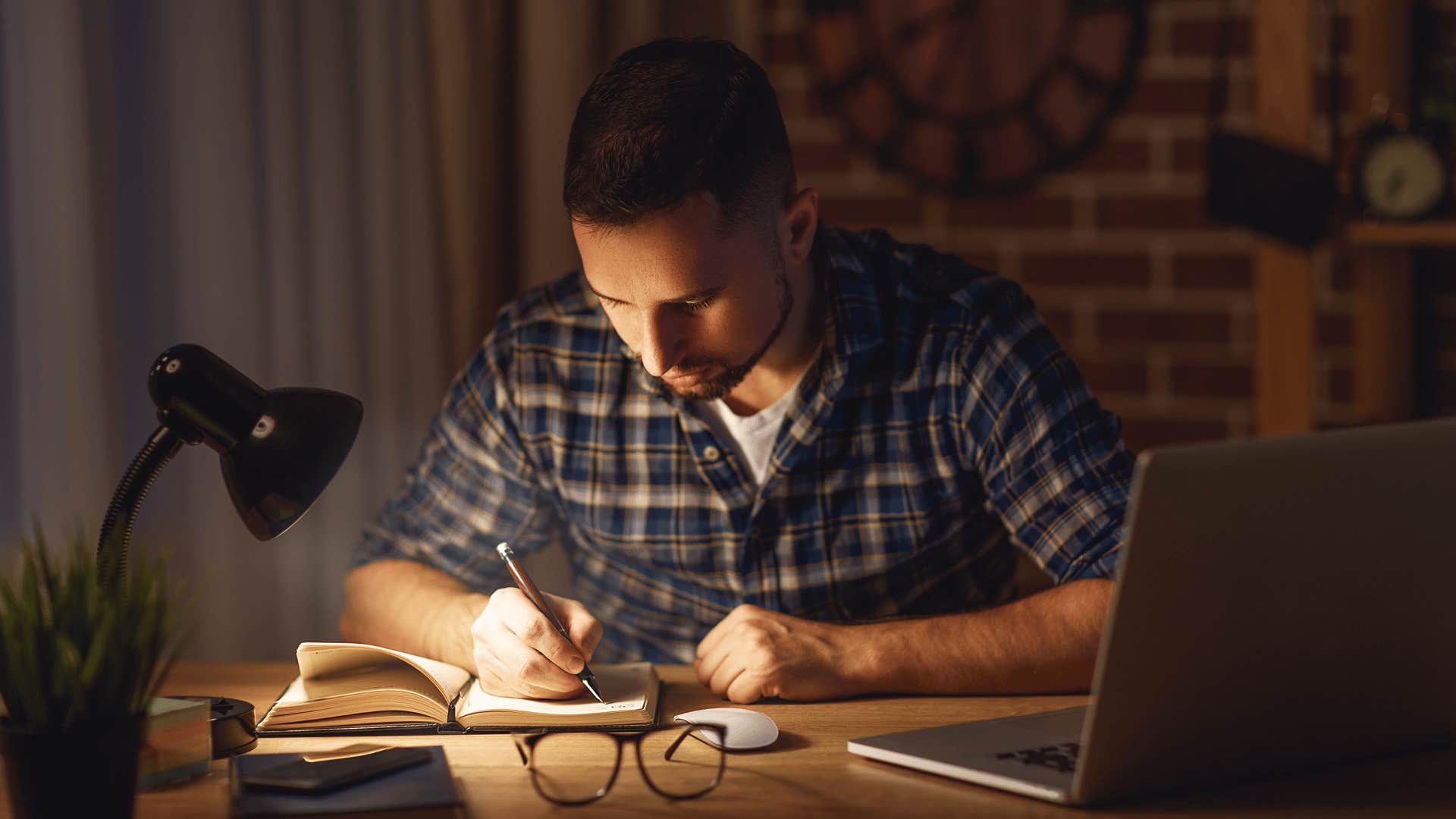 man concentrating on work late at night