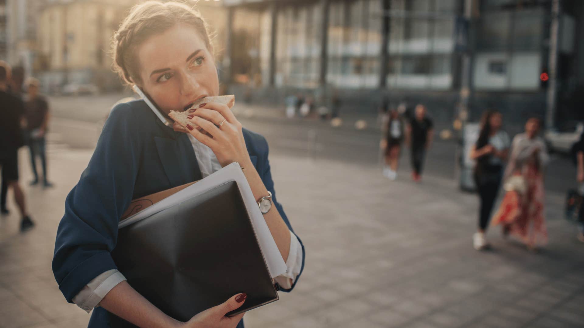 woman eating while in a rush 