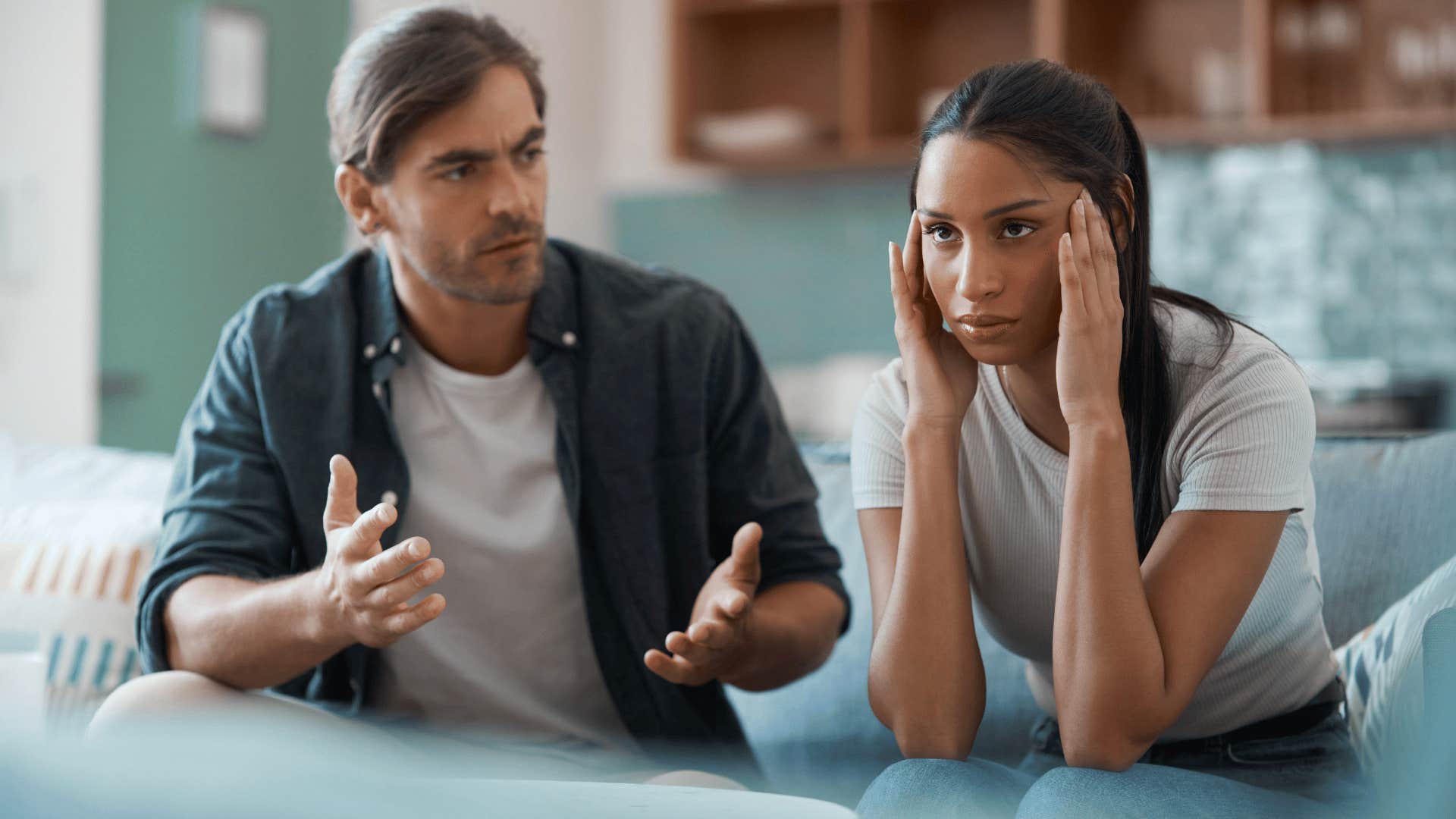 woman looking done while man argues with her