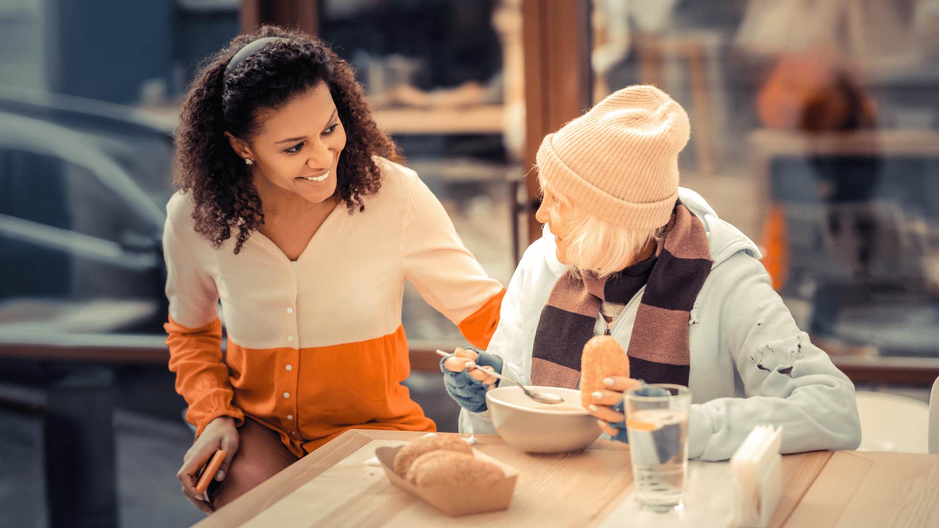 woman helping out other woman