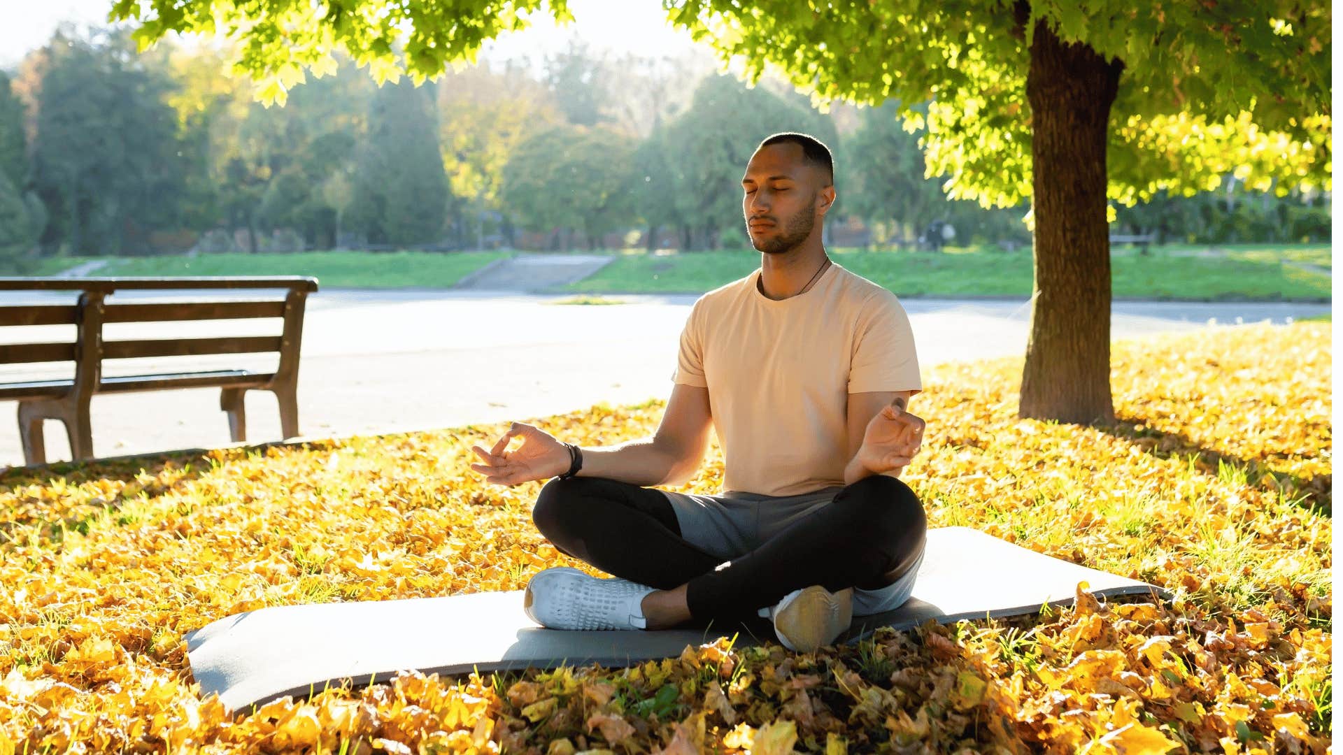 man meditating outside