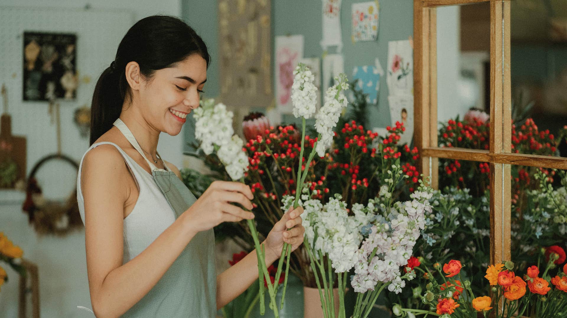 authentic woman smelling flowers