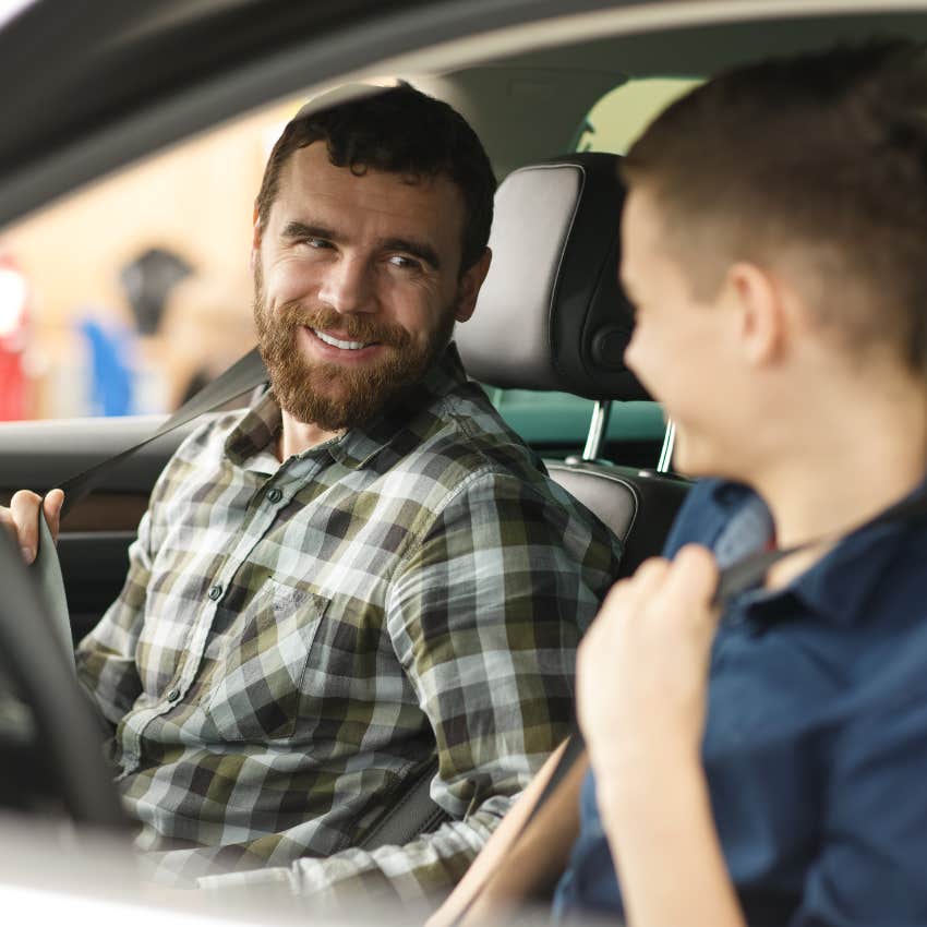 Teenage son and dad car shopping together.