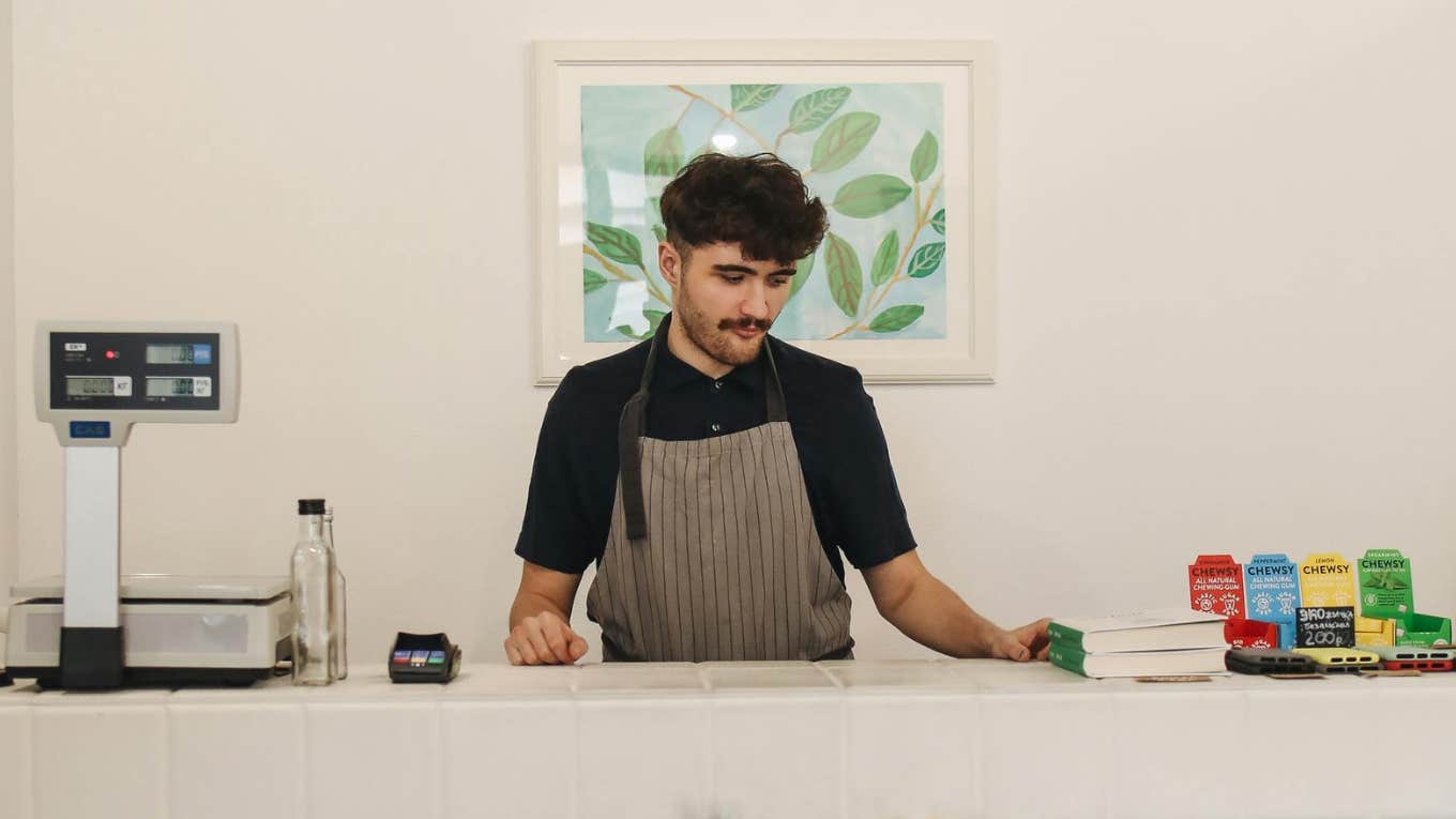 Cashier standing at counter