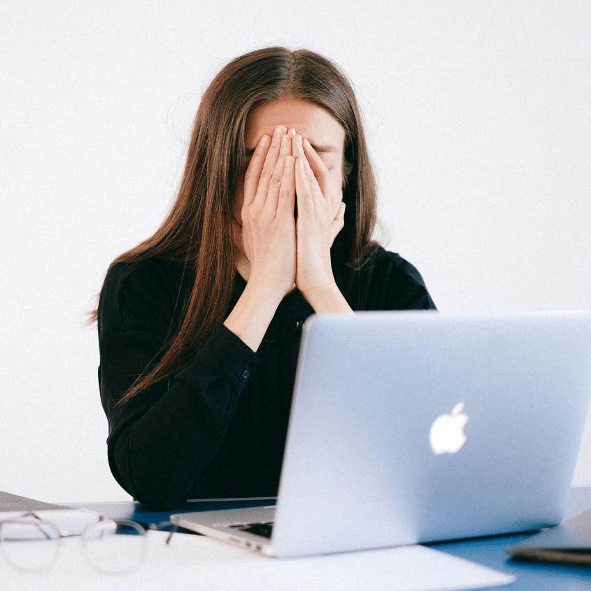 stressed woman covering face