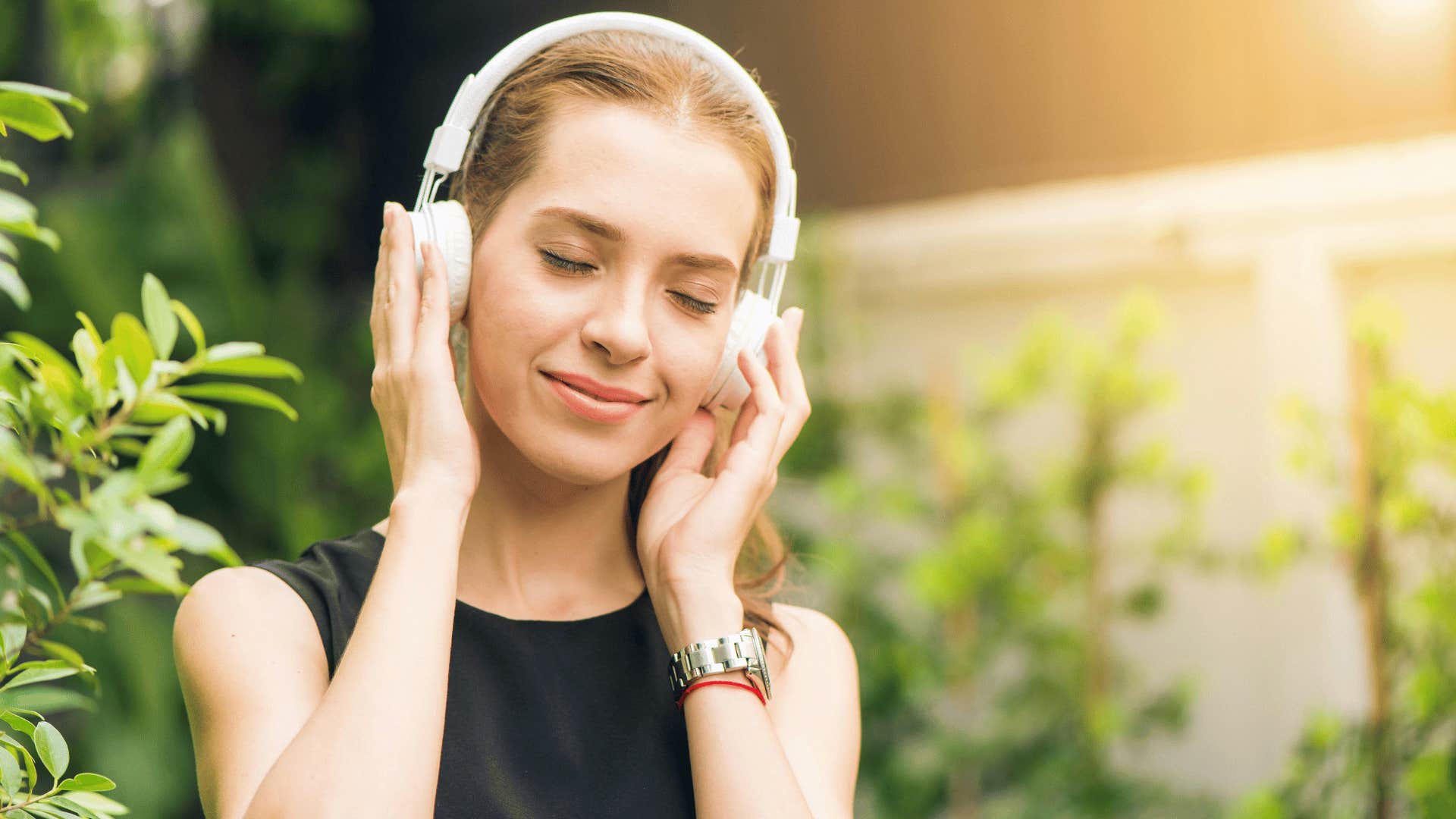 woman listening to music outside 