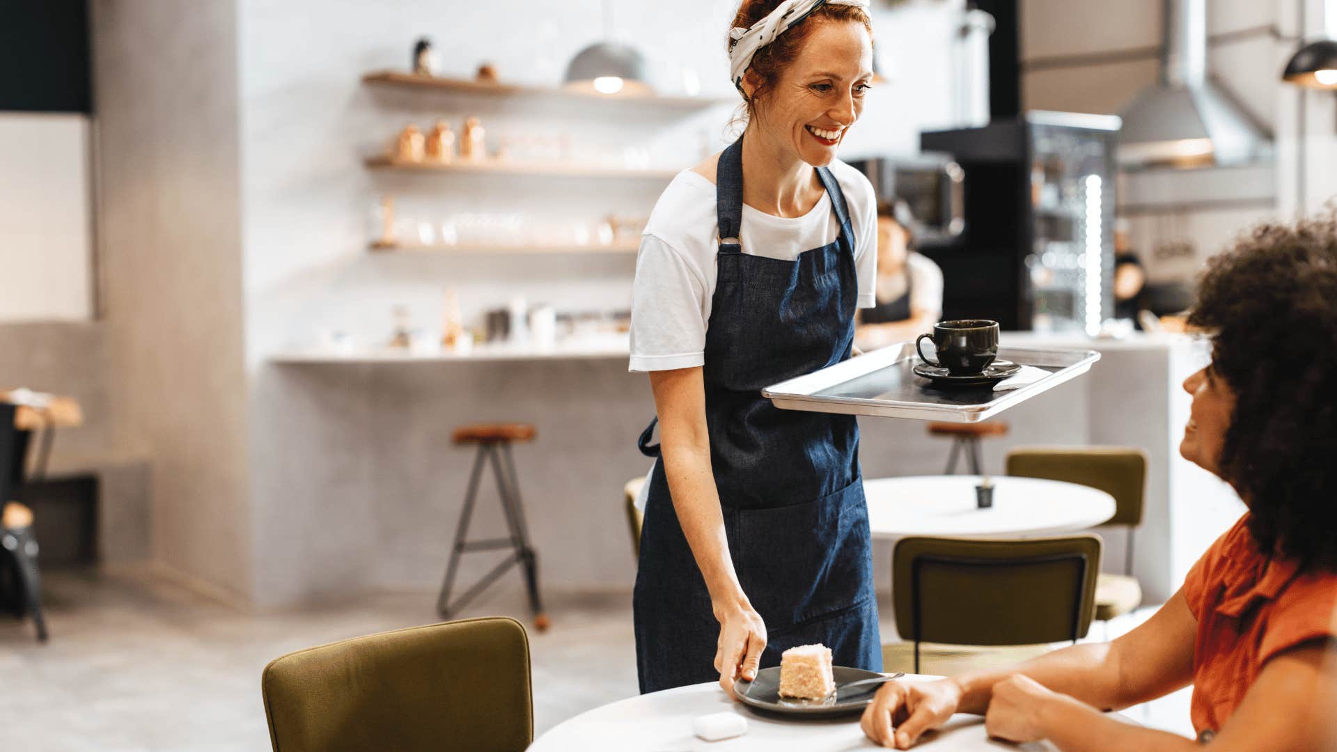 woman ordering coffee from server