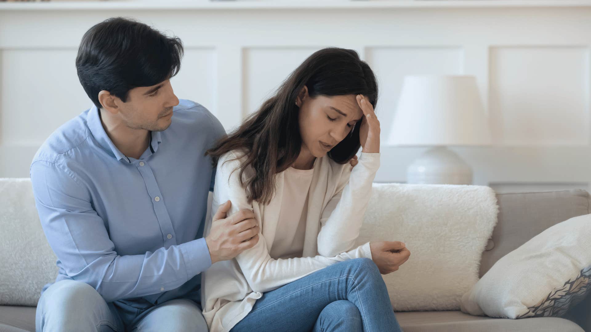 man comforting a woman