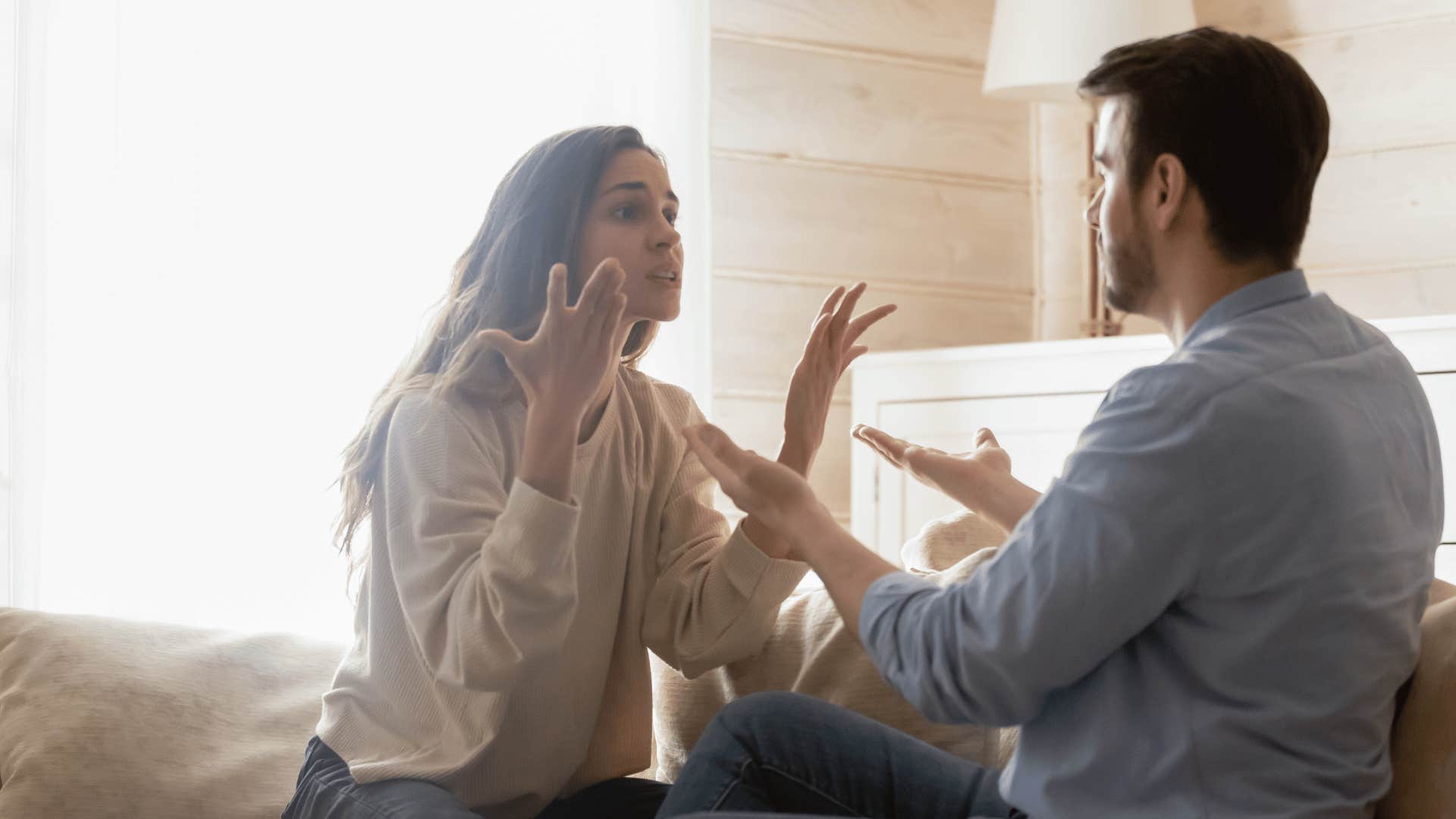 couple arguing on couch