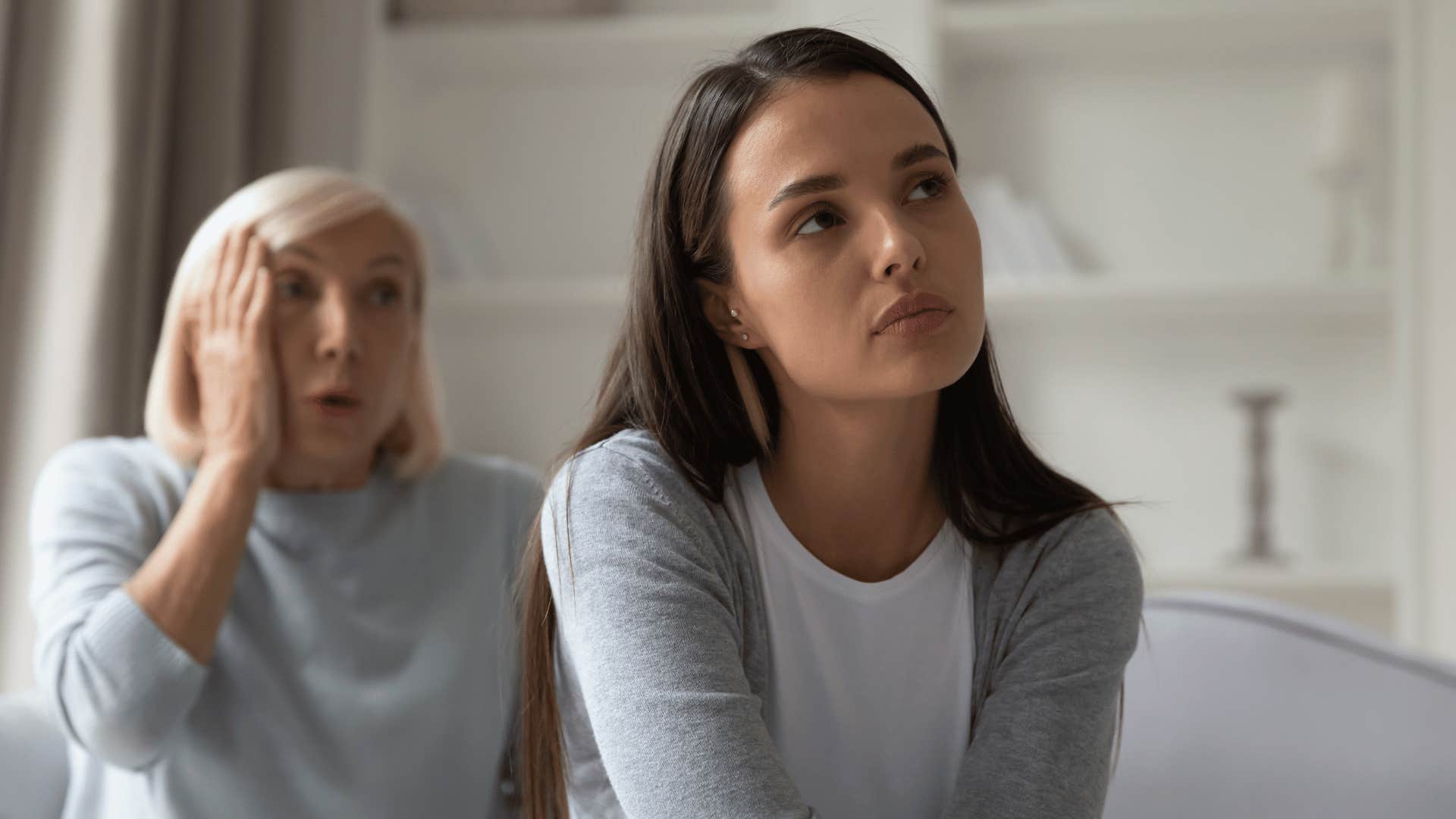 older woman talking to younger woman 