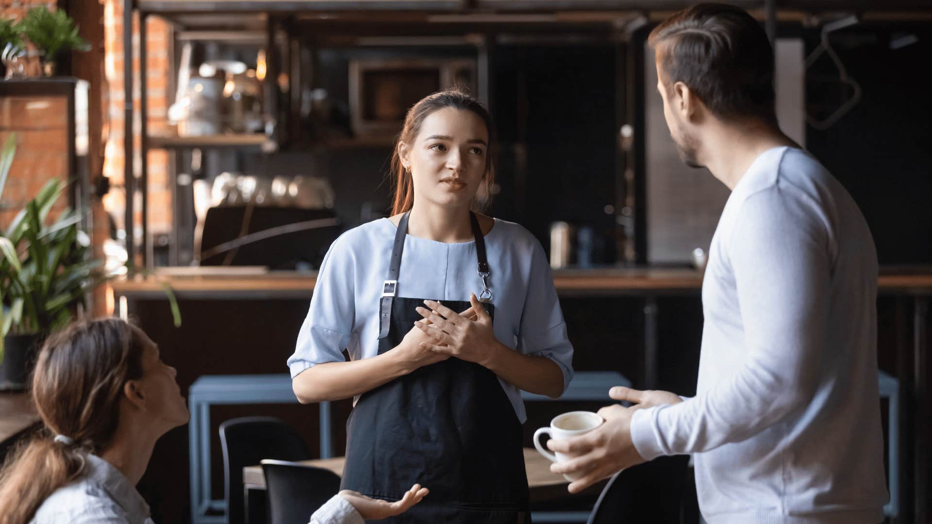 man upset with waitress