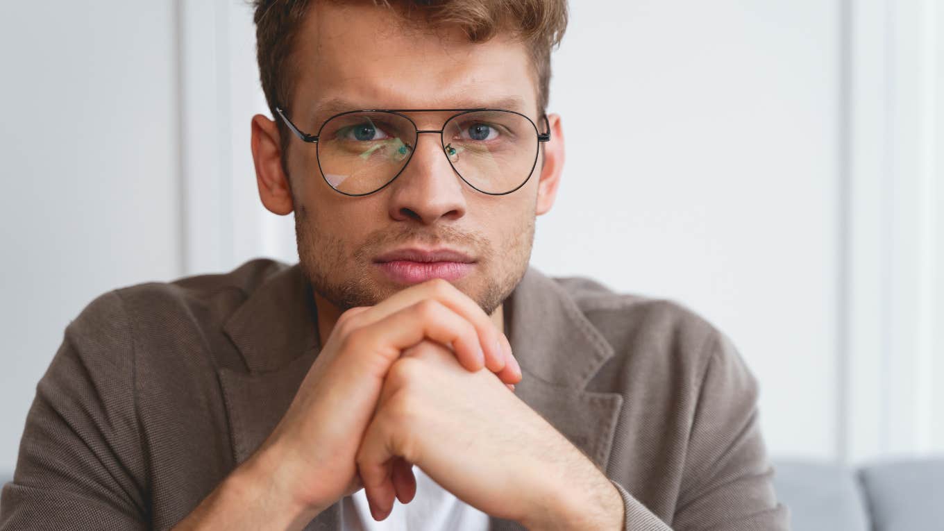 attractive serious man in glasses