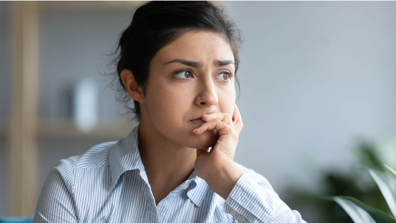 Woman worrying about making her dad proud. 