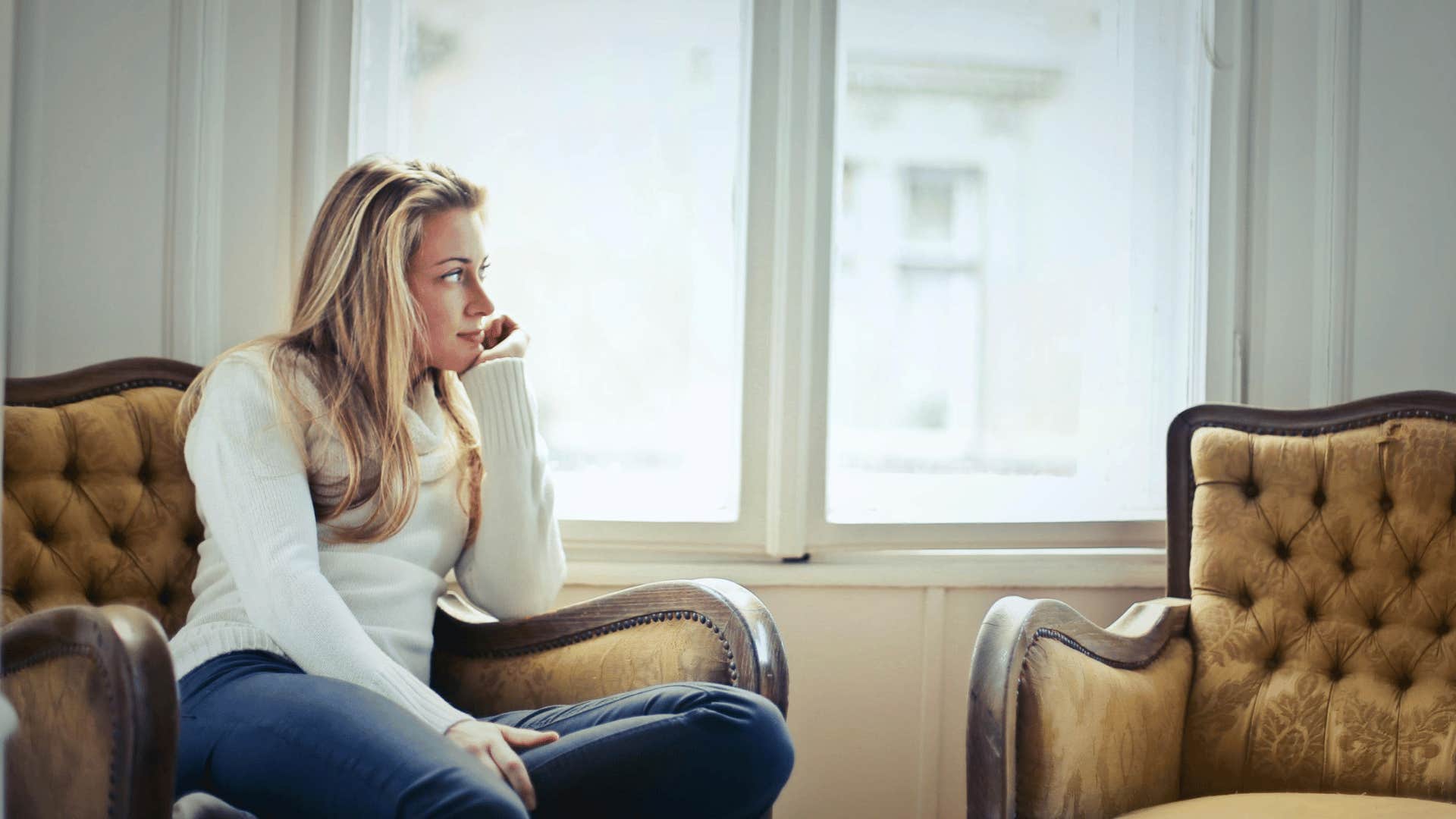 woman looking out the window