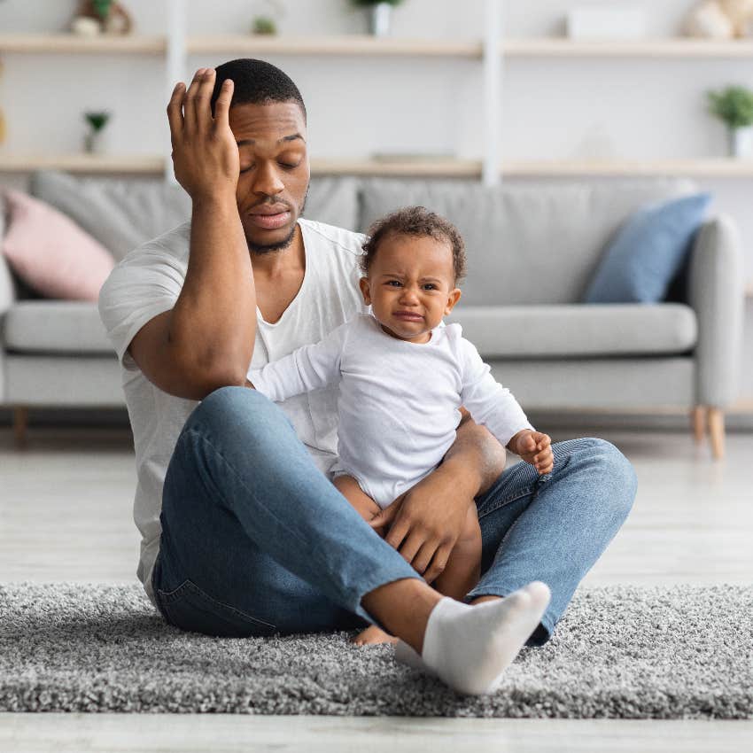 Tired dad with baby