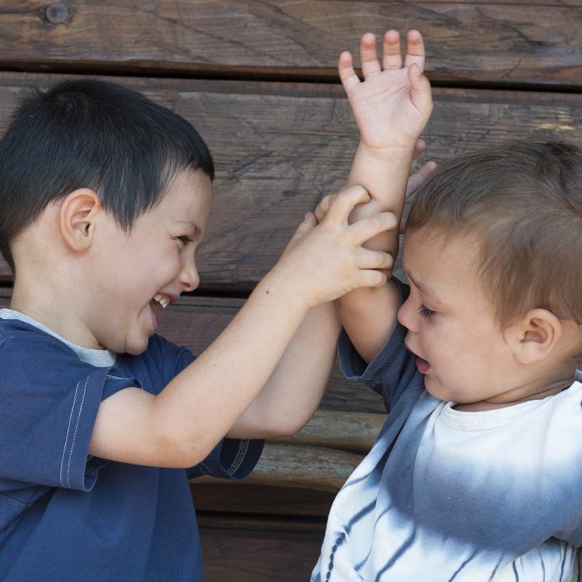 Little boy hurting a baby at preschool