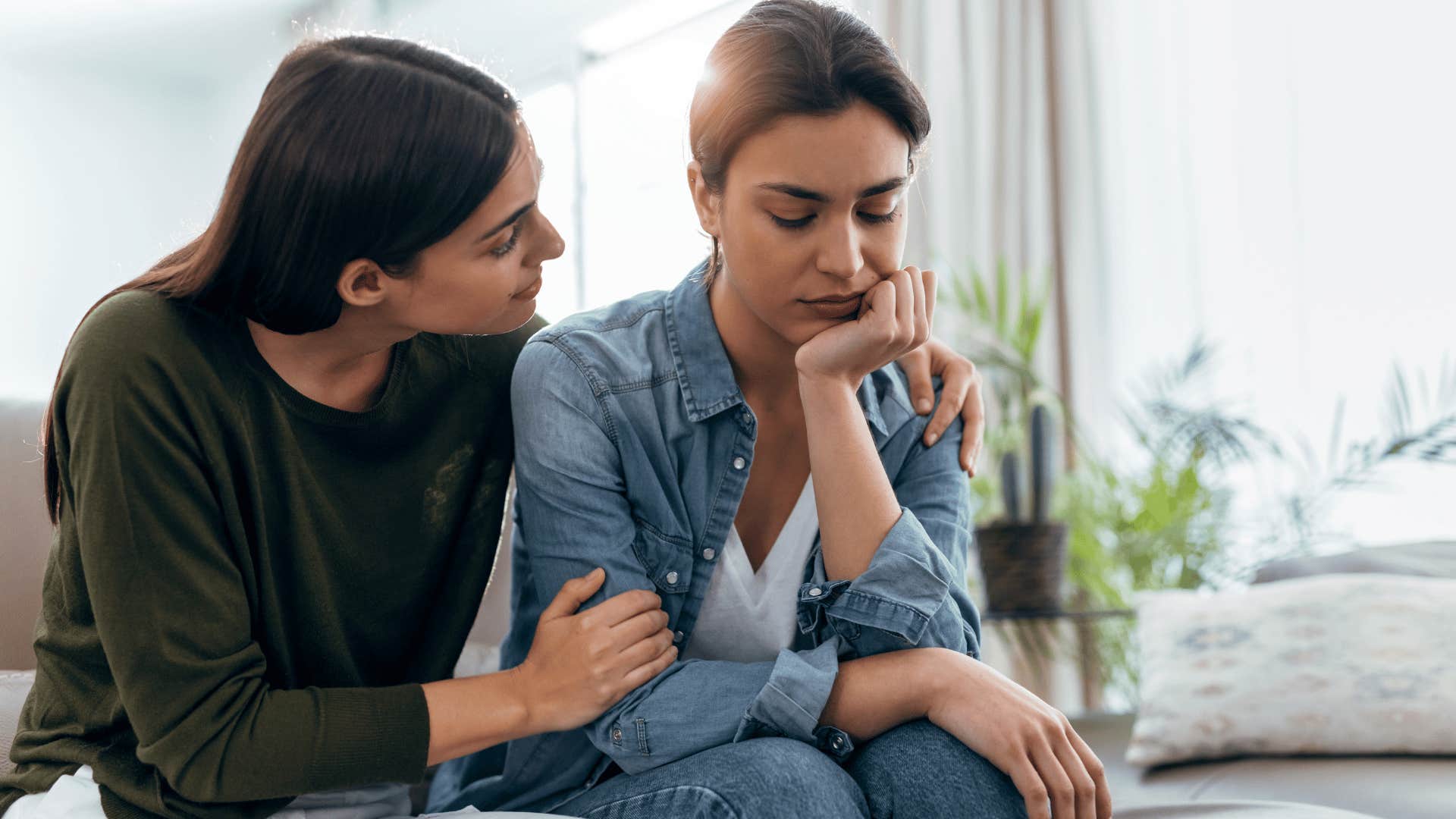 woman comforting other woman