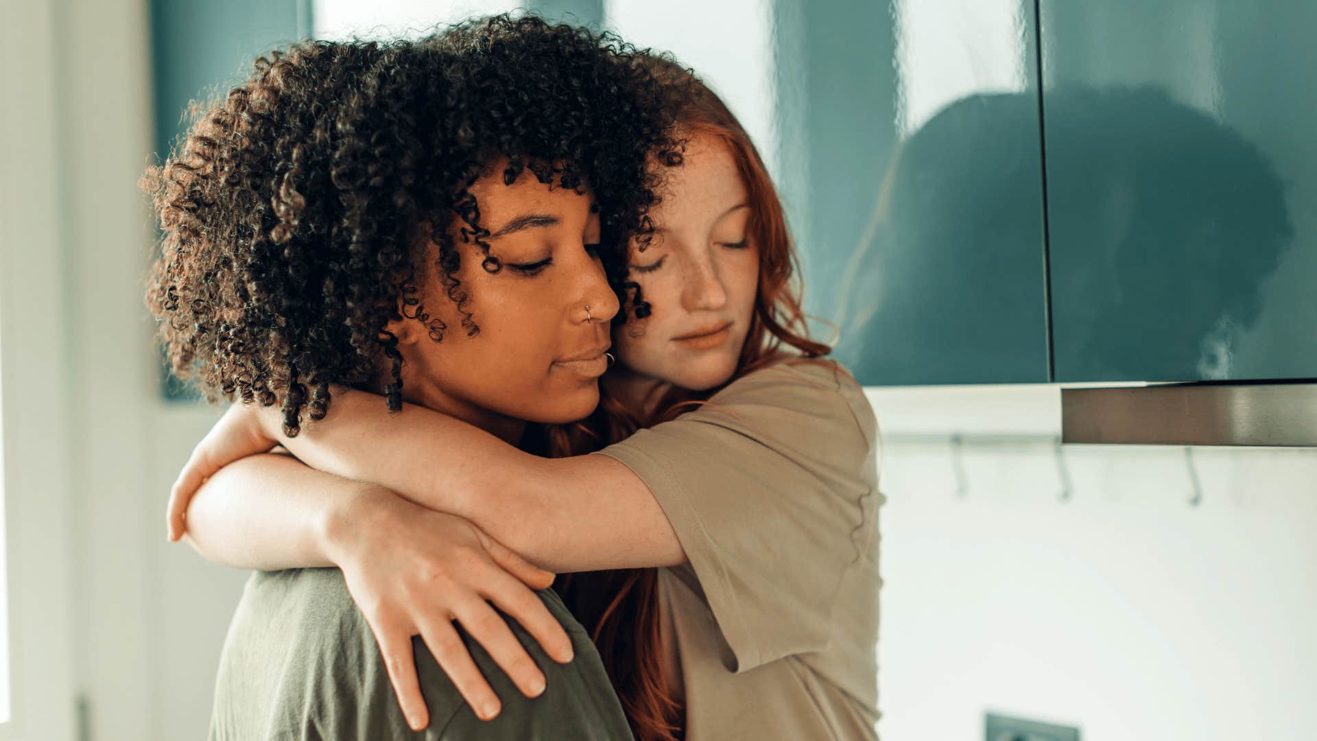 woman hugging other woman