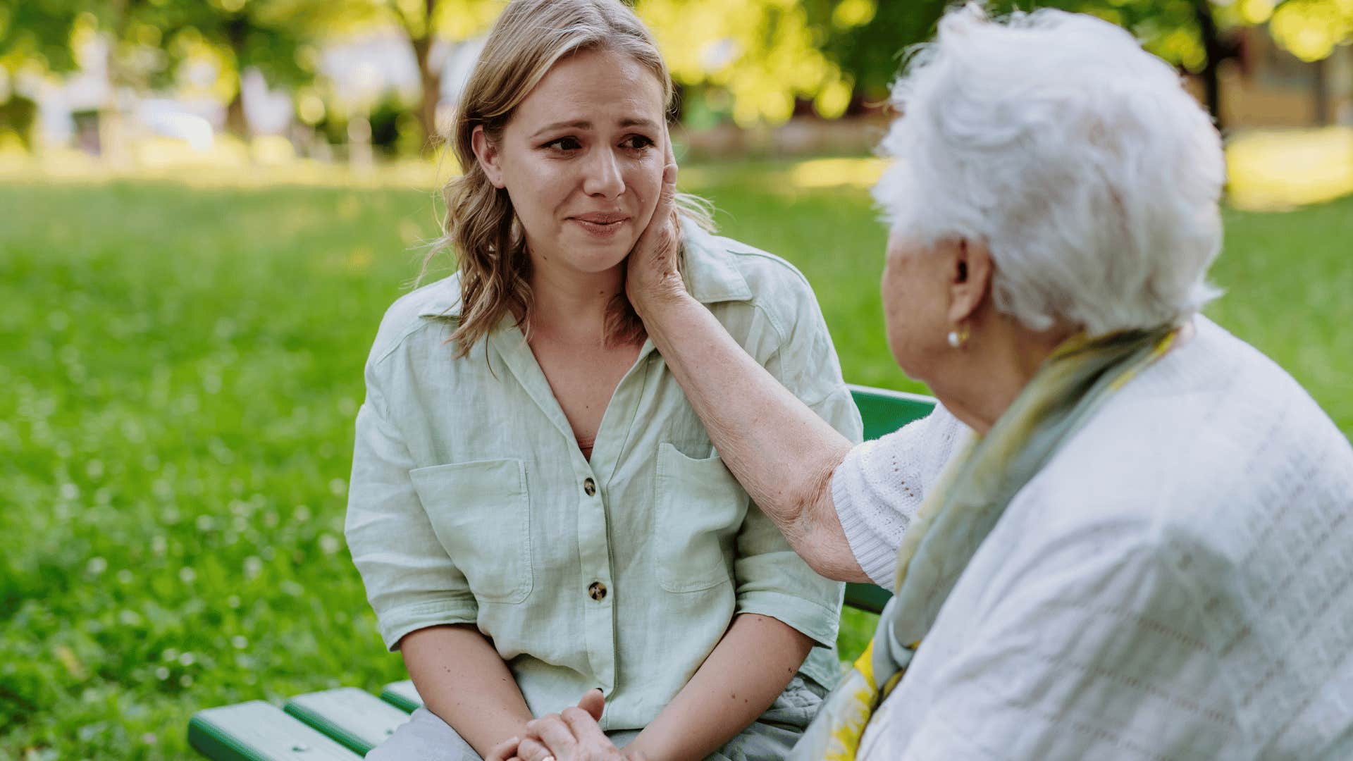 older woman comforting crying younger woman