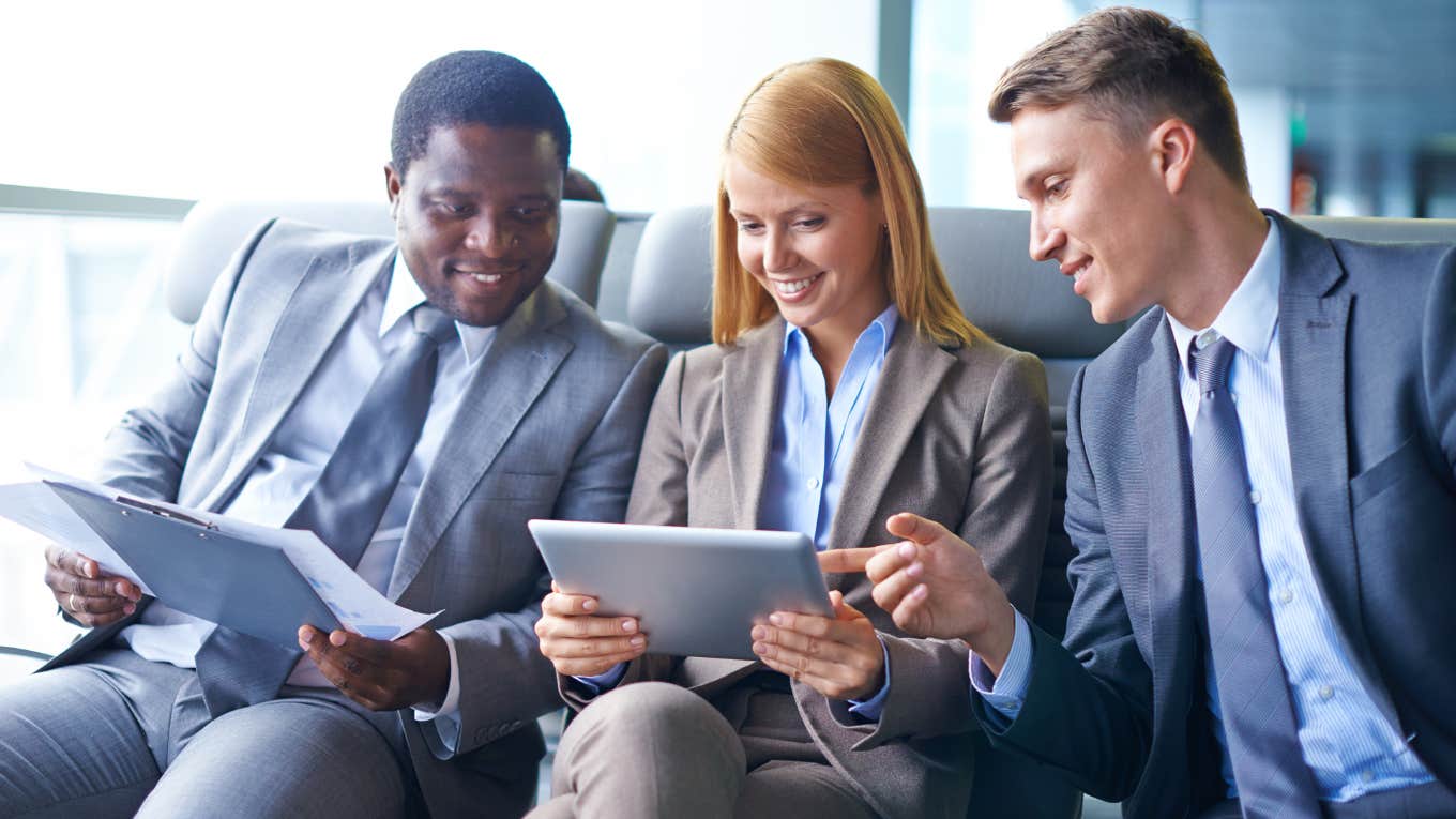 Executives talking business in an airport