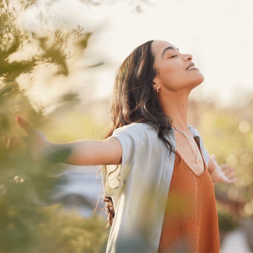 woman standing in sunshine