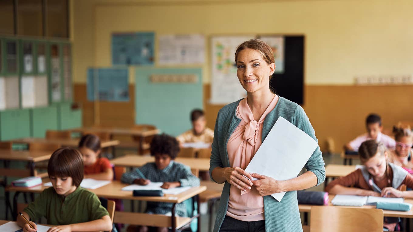 Teacher standing in front of elementary school class