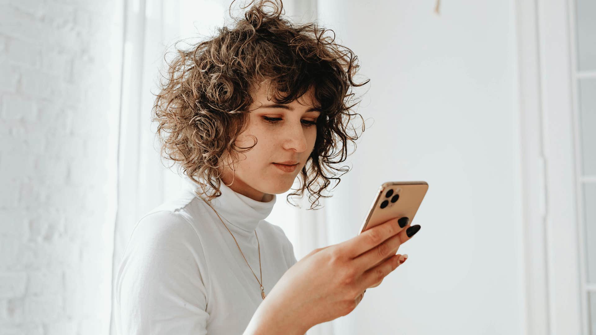 woman looking at phone