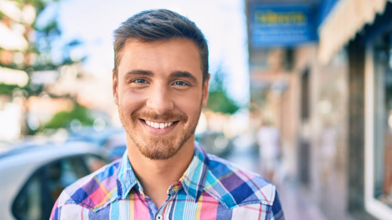 smiling man trying to earn respect of others