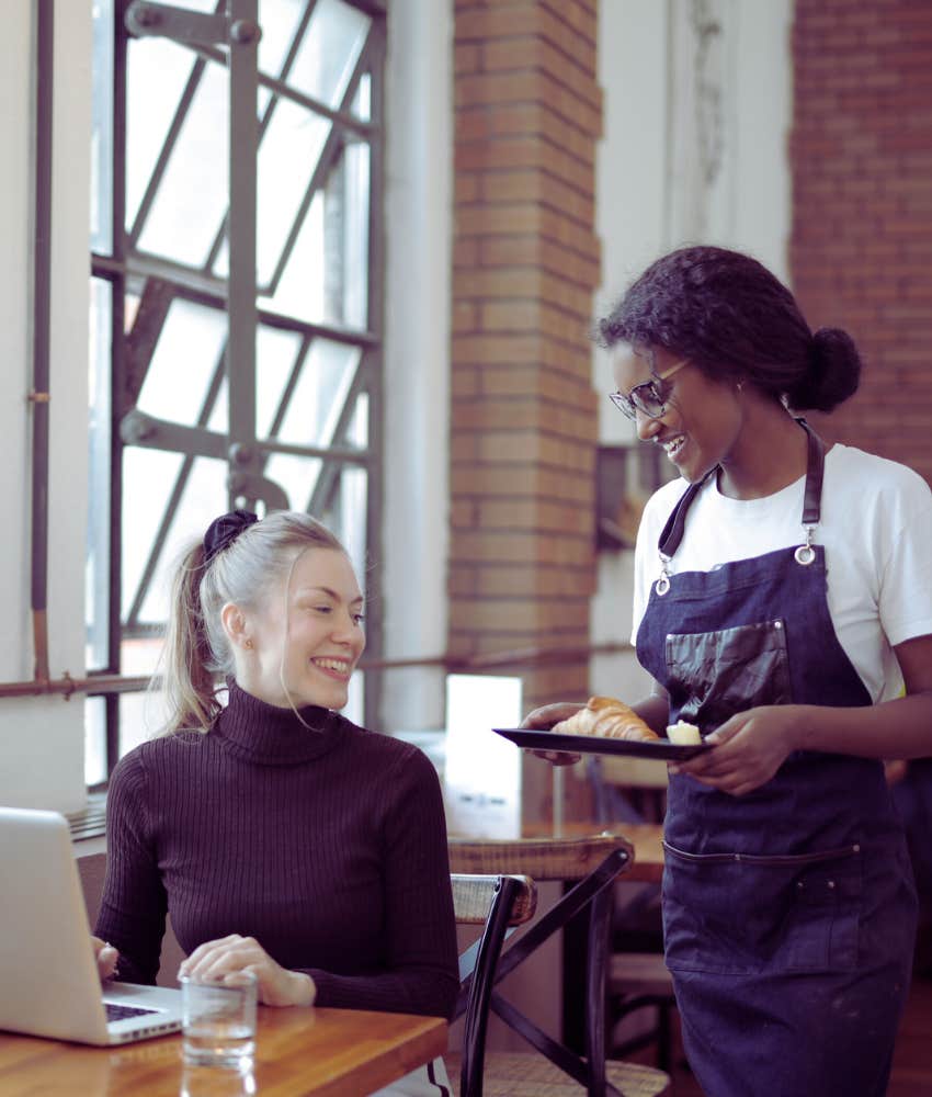 Server bringing croissant to customer